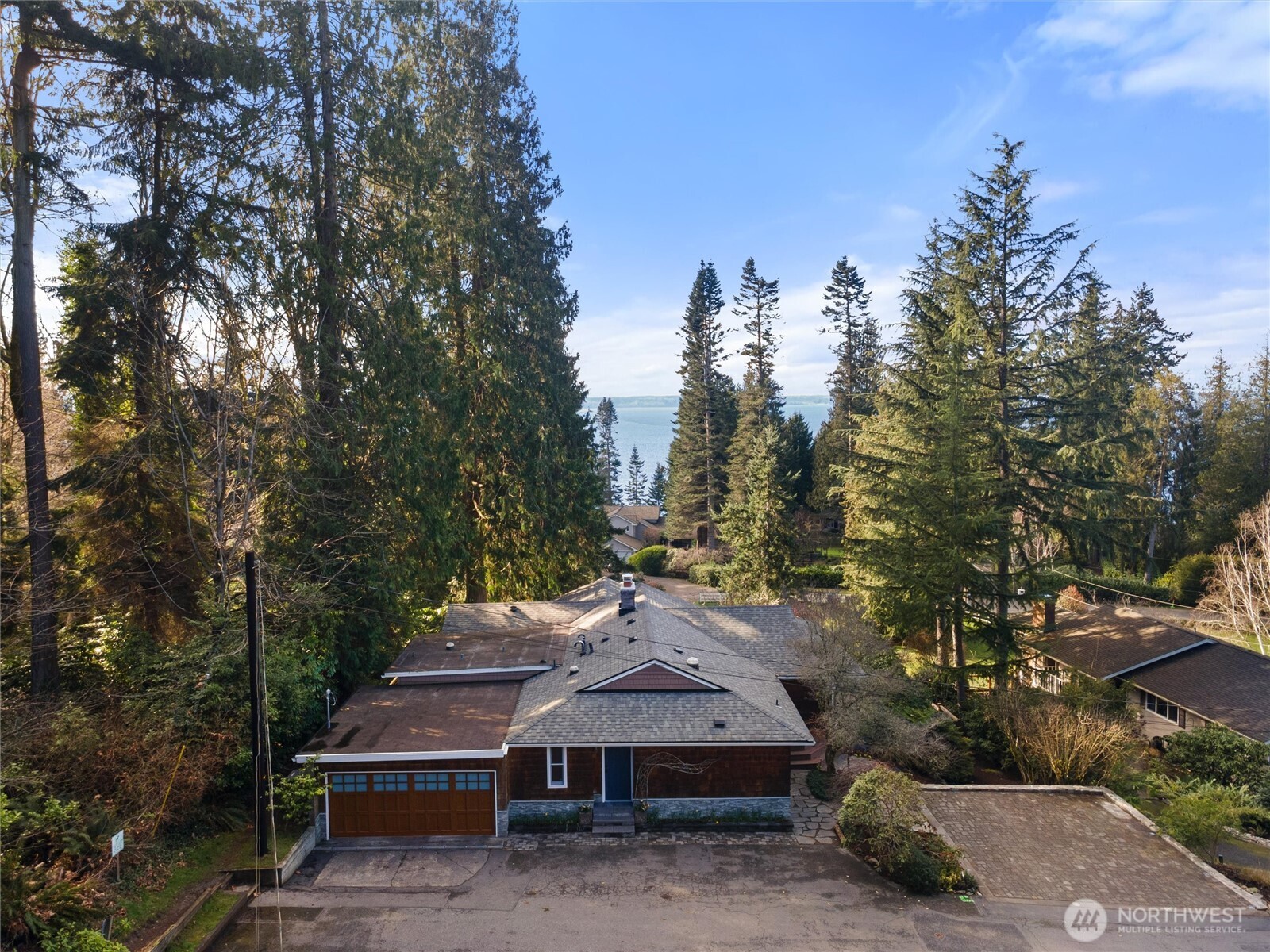 18431 High Street Edmonds, WA 98020 - Photo 27 of 40 a view of a wooden deck and trees in the background