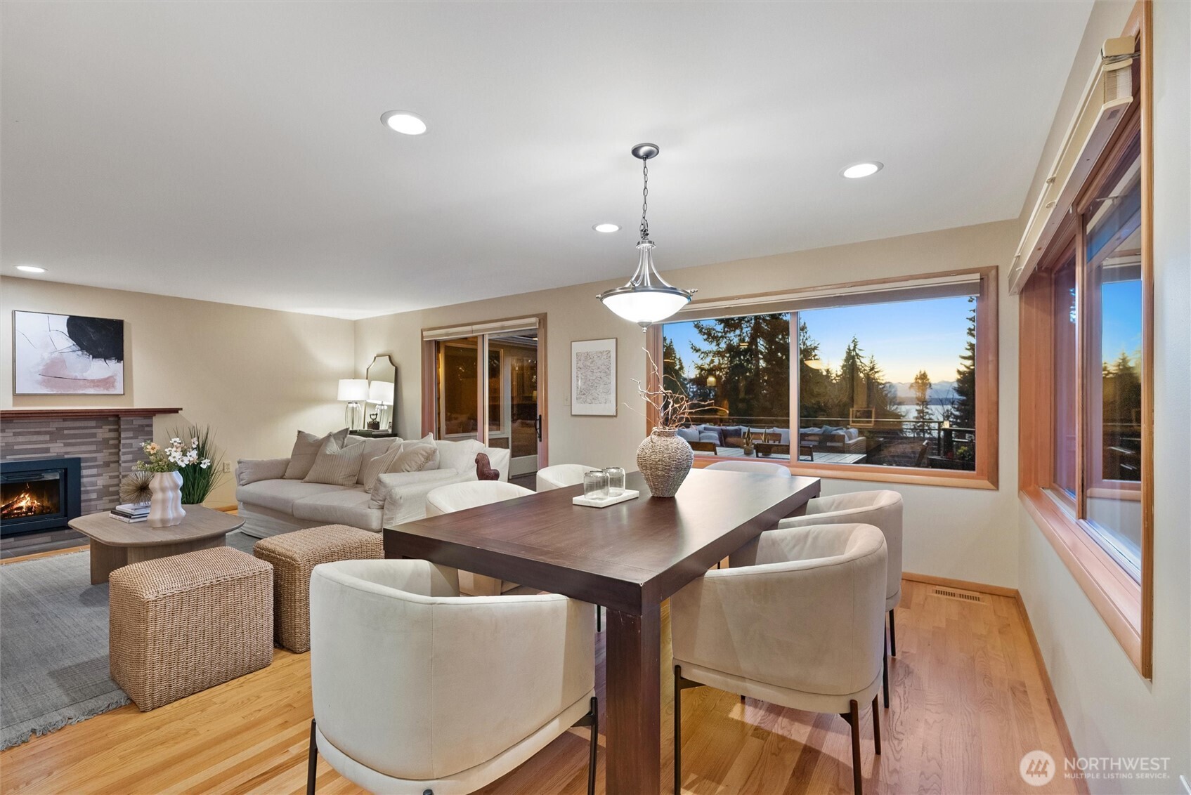18431 High Street Edmonds, WA 98020 - Photo 4 of 40 a dining room with furniture a floor to ceiling window and kitchen view
