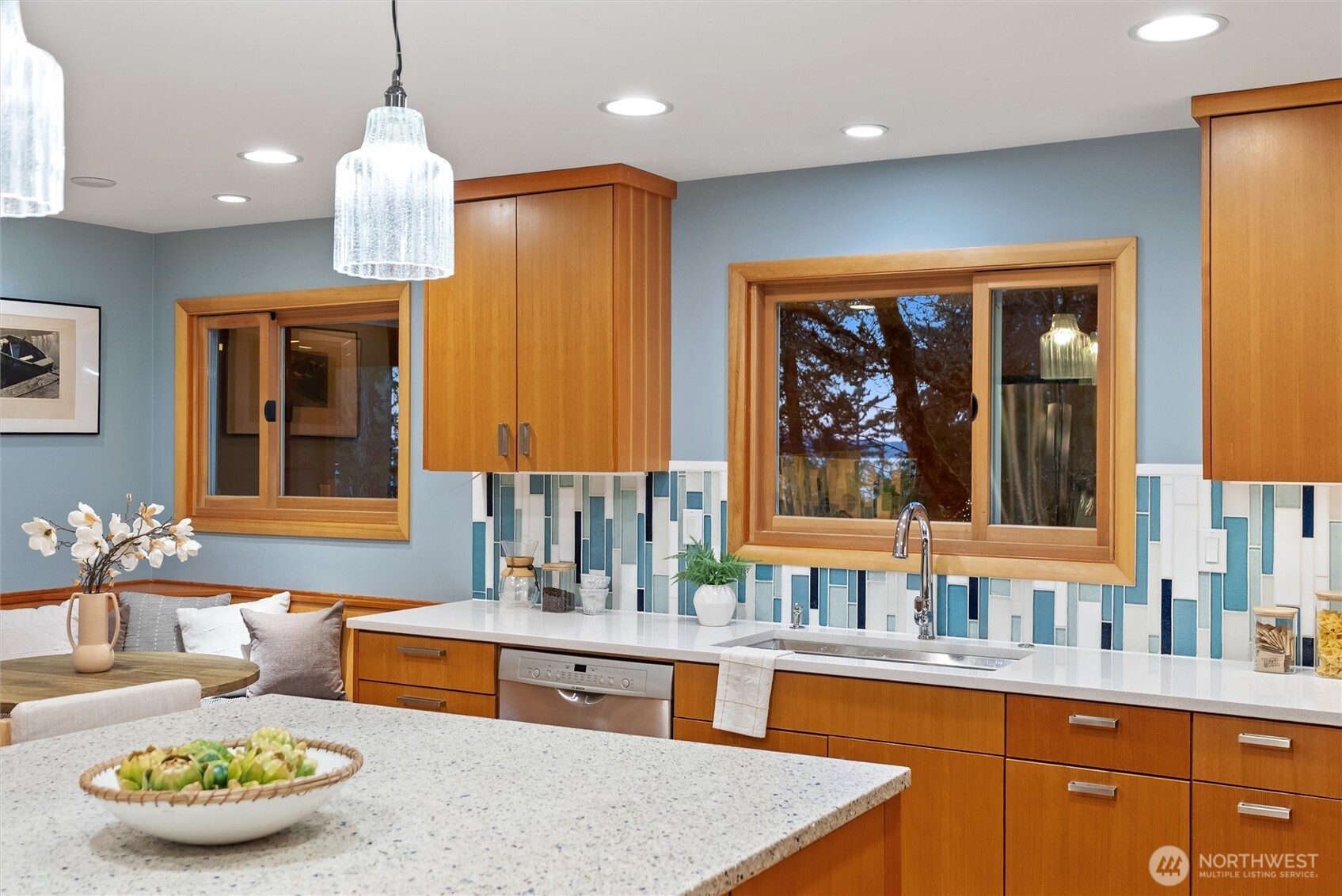 18431 High Street Edmonds, WA 98020 - Photo 8 of 40 a large kitchen with kitchen island stainless steel appliances a sink and a counter space