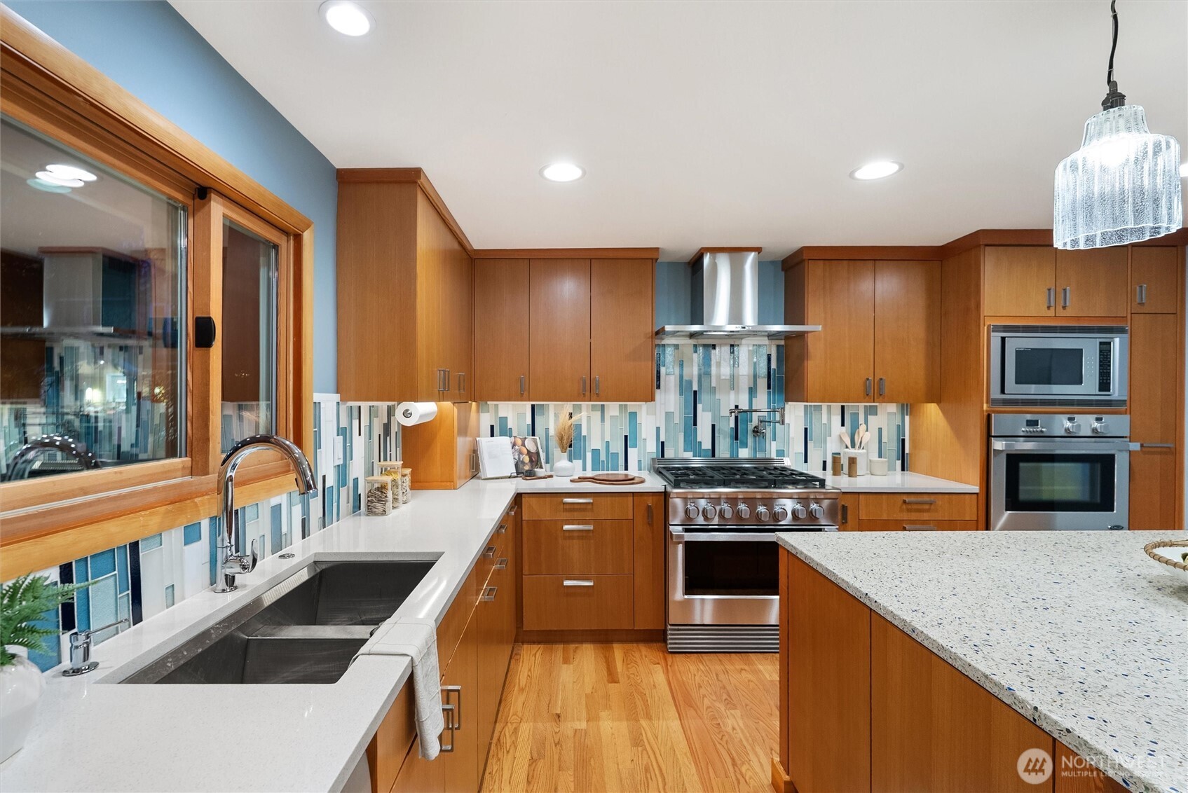 18431 High Street Edmonds, WA 98020 - Photo 9 of 40 a kitchen with stainless steel appliances granite countertop a stove and a sink