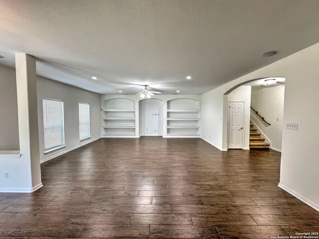 a kitchen with stainless steel appliances granite countertop sink stove and large window
