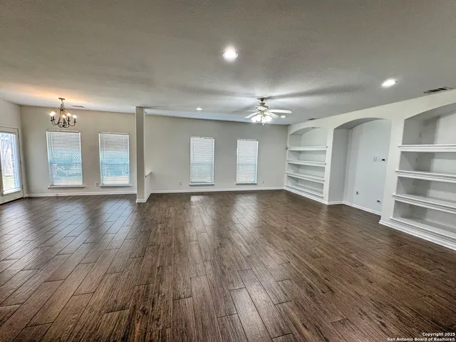 a view of a livingroom with wooden floor