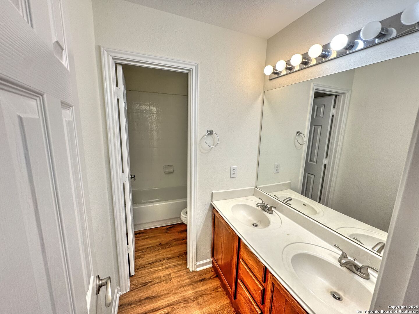 8711 Sandia Circle Helotes, TX 78023 - Photo 22 of 40 a bathroom with a sink a toilet and shower