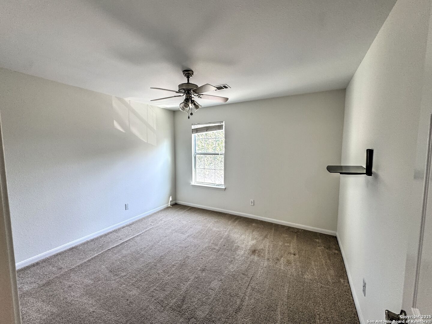 8711 Sandia Circle Helotes, TX 78023 - Photo 24 of 40 a view of an empty room with a window