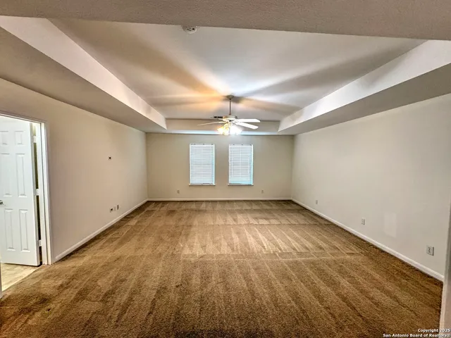 a view of a hallway with windows