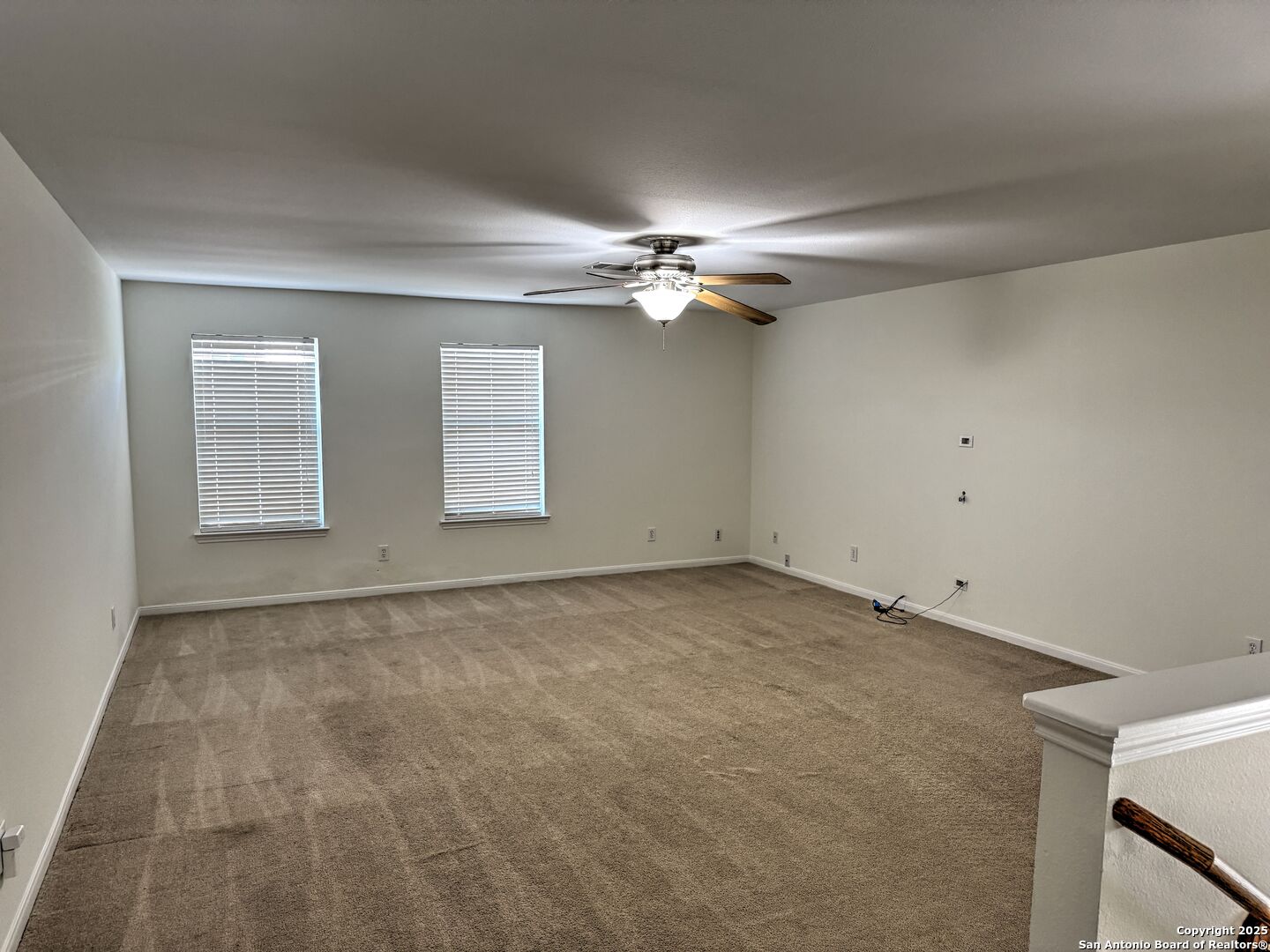 8711 Sandia Circle Helotes, TX 78023 - Photo 36 of 40 a view of an empty room with a ceiling fan