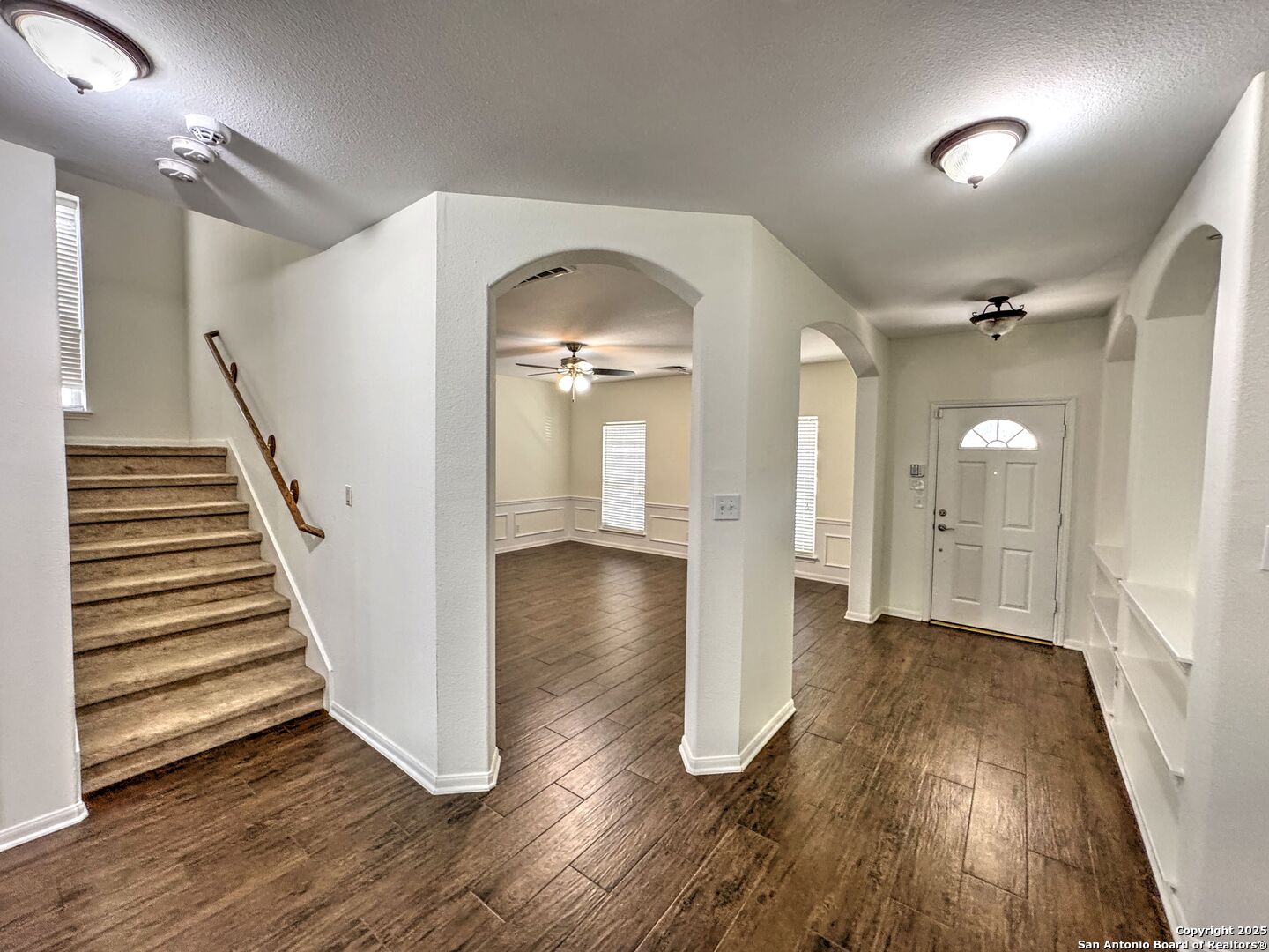 8711 Sandia Circle Helotes, TX 78023 - Photo 4 of 40 a view of a room with wooden floor and stairs