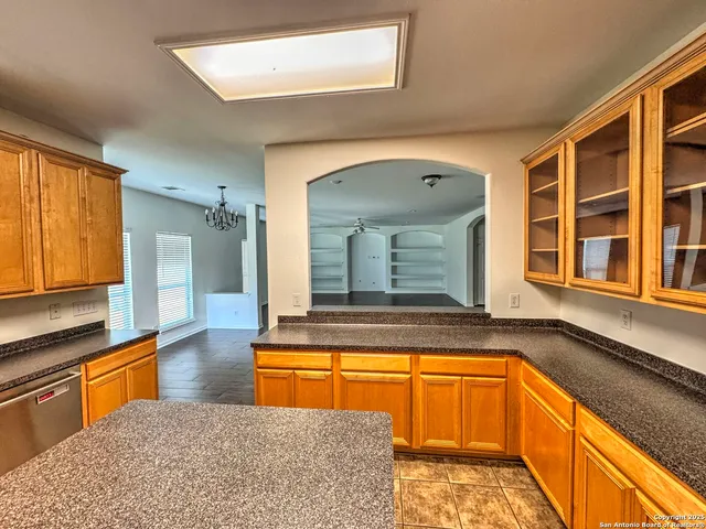 a view of a kitchen with a sink and living room