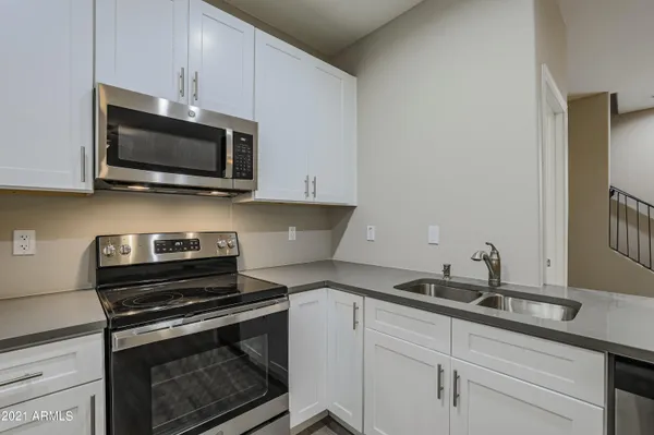 a kitchen with a stove and a microwave