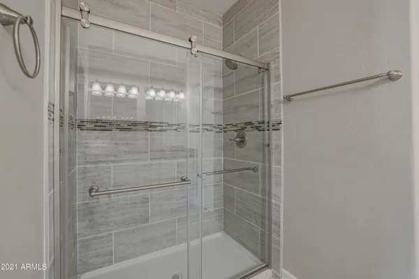 a bathroom with a shower and a bathtub
