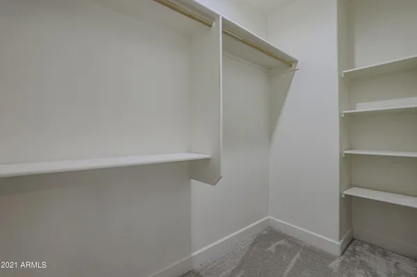 a view of an empty walk in closet