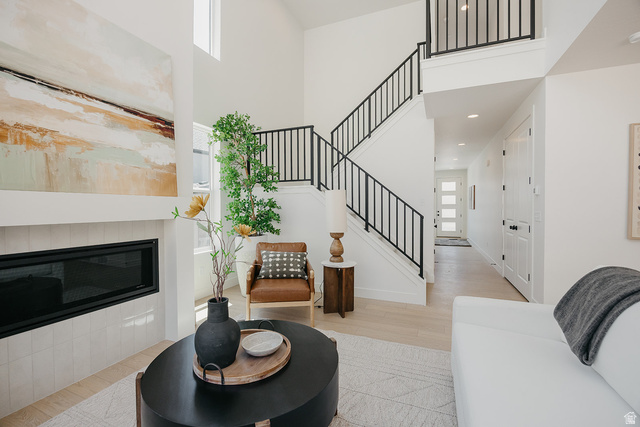 5902 Canyon Rim Road, Unit 620 Lehi, UT 84048 - Photo 25 of 78 Two-story entry featuring light wood-finish flooring and a contemporary linear fireplace with white tile surround
