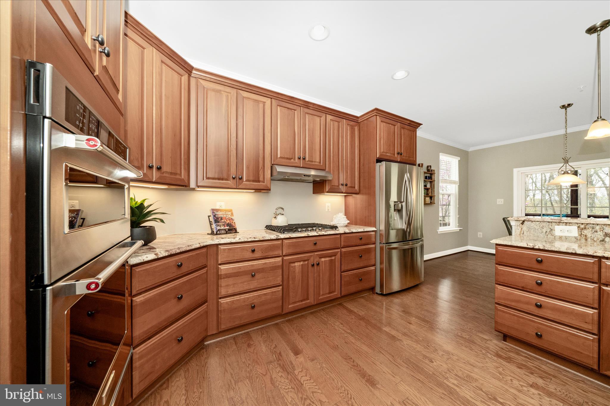 3156 Sumantown Road Middletown, MD 21769 - Photo 10 of 62 a kitchen with granite countertop wooden cabinets and stainless steel appliances