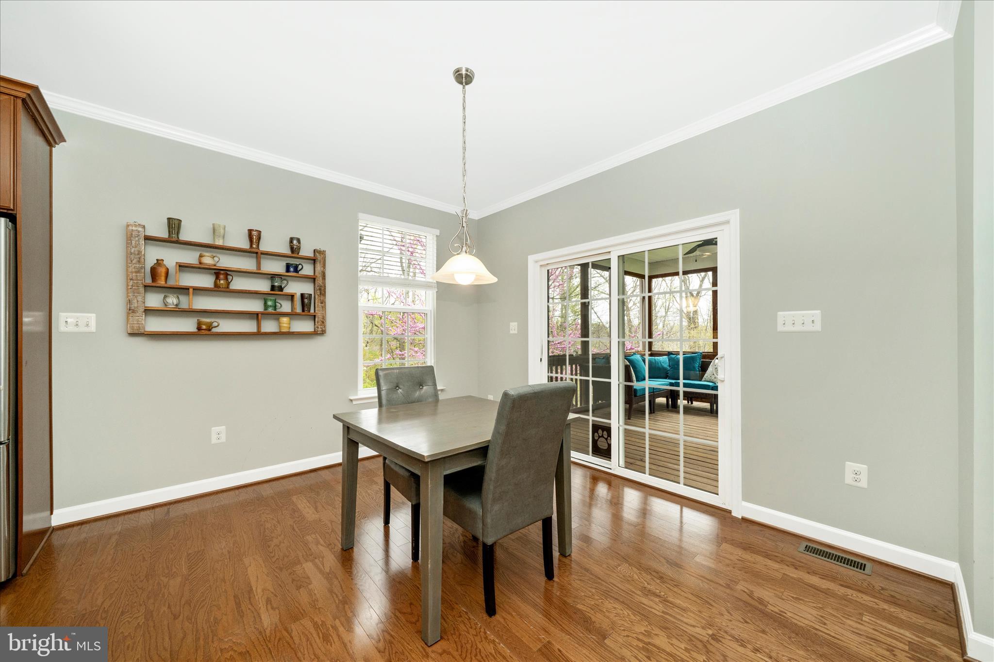 3156 Sumantown Road Middletown, MD 21769 - Photo 15 of 62 a view of a dining room with furniture window and wooden floor