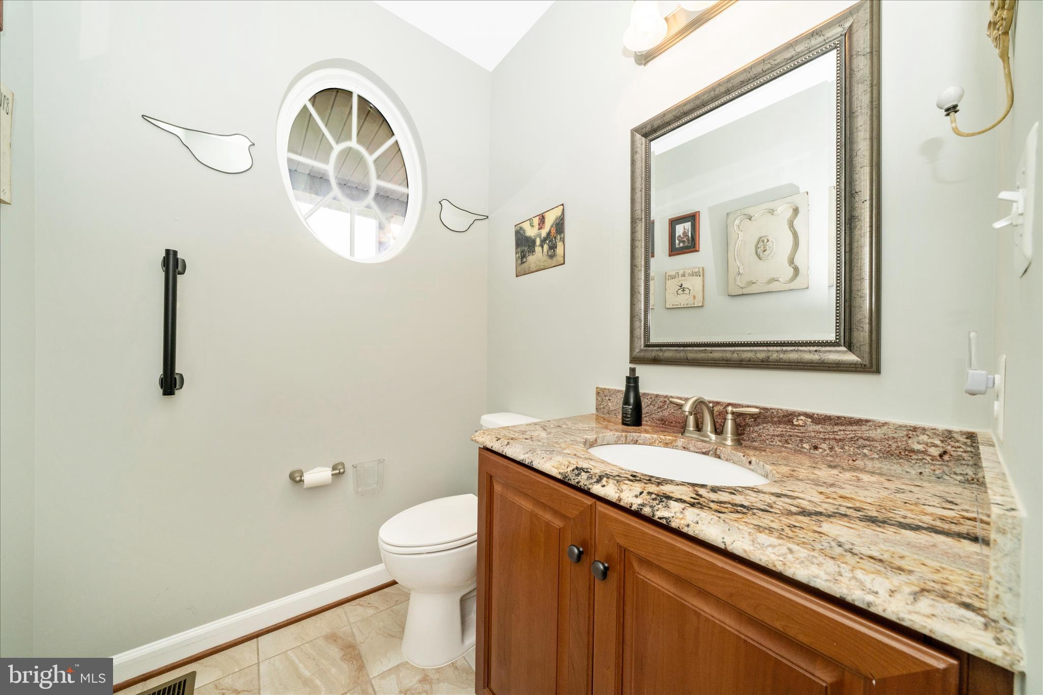 3156 Sumantown Road Middletown, MD 21769 - Photo 25 of 62 a bathroom with a granite countertop sink mirror vanity and toilet
