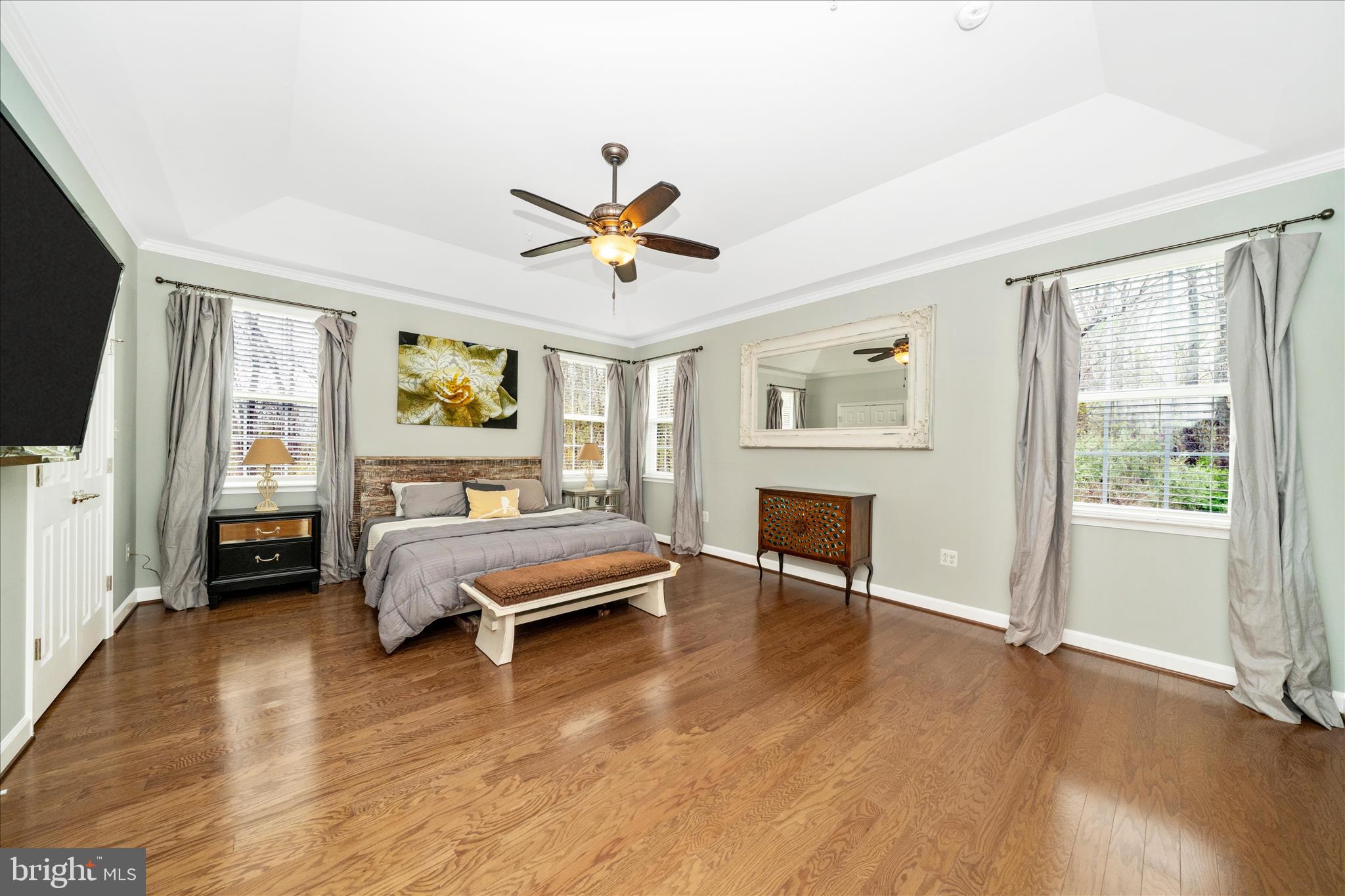 3156 Sumantown Road Middletown, MD 21769 - Photo 27 of 62 a spacious bedroom with a bed and a chandelier