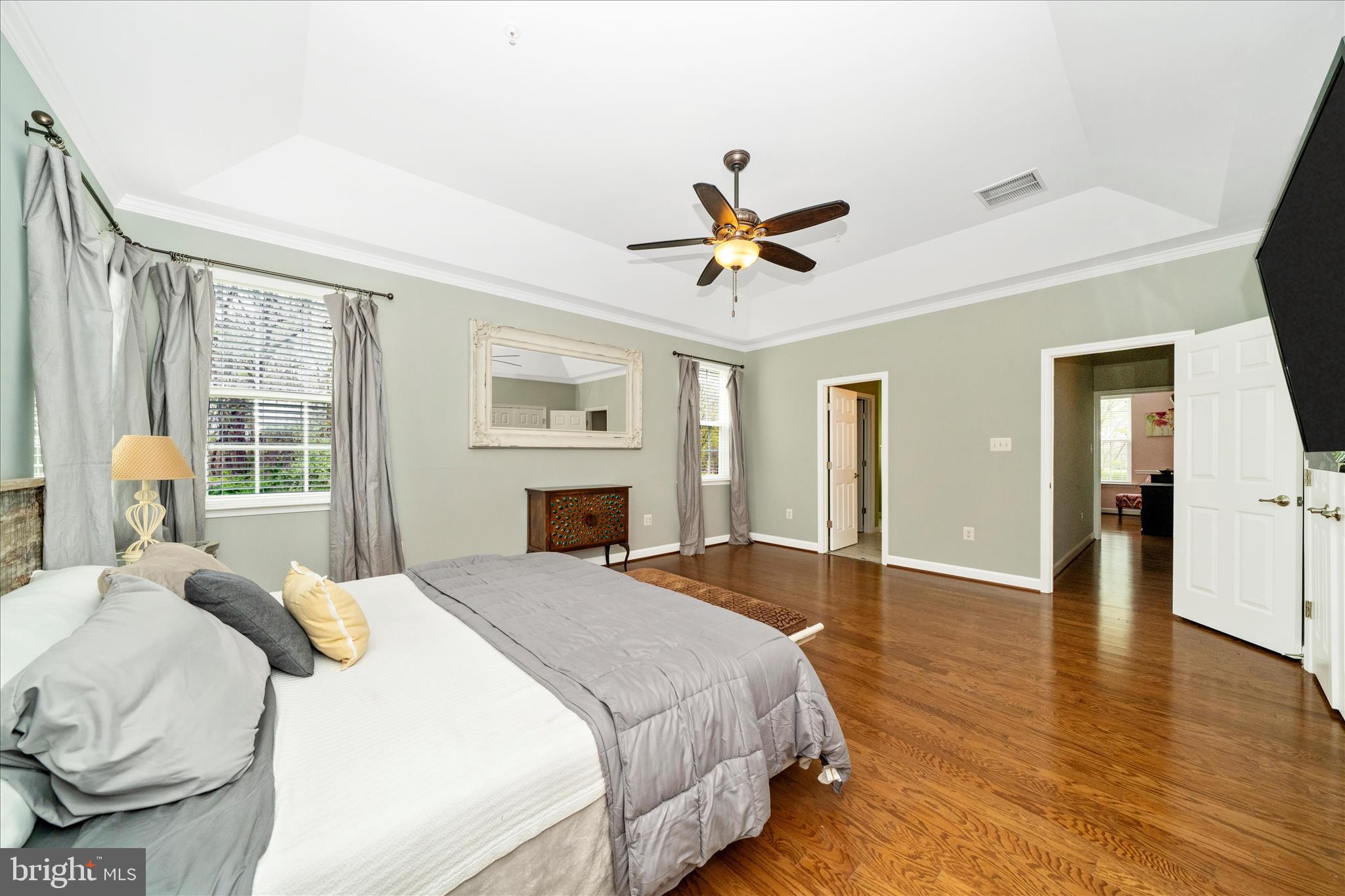 3156 Sumantown Road Middletown, MD 21769 - Photo 30 of 62 a spacious bedroom with a bed and a chandelier