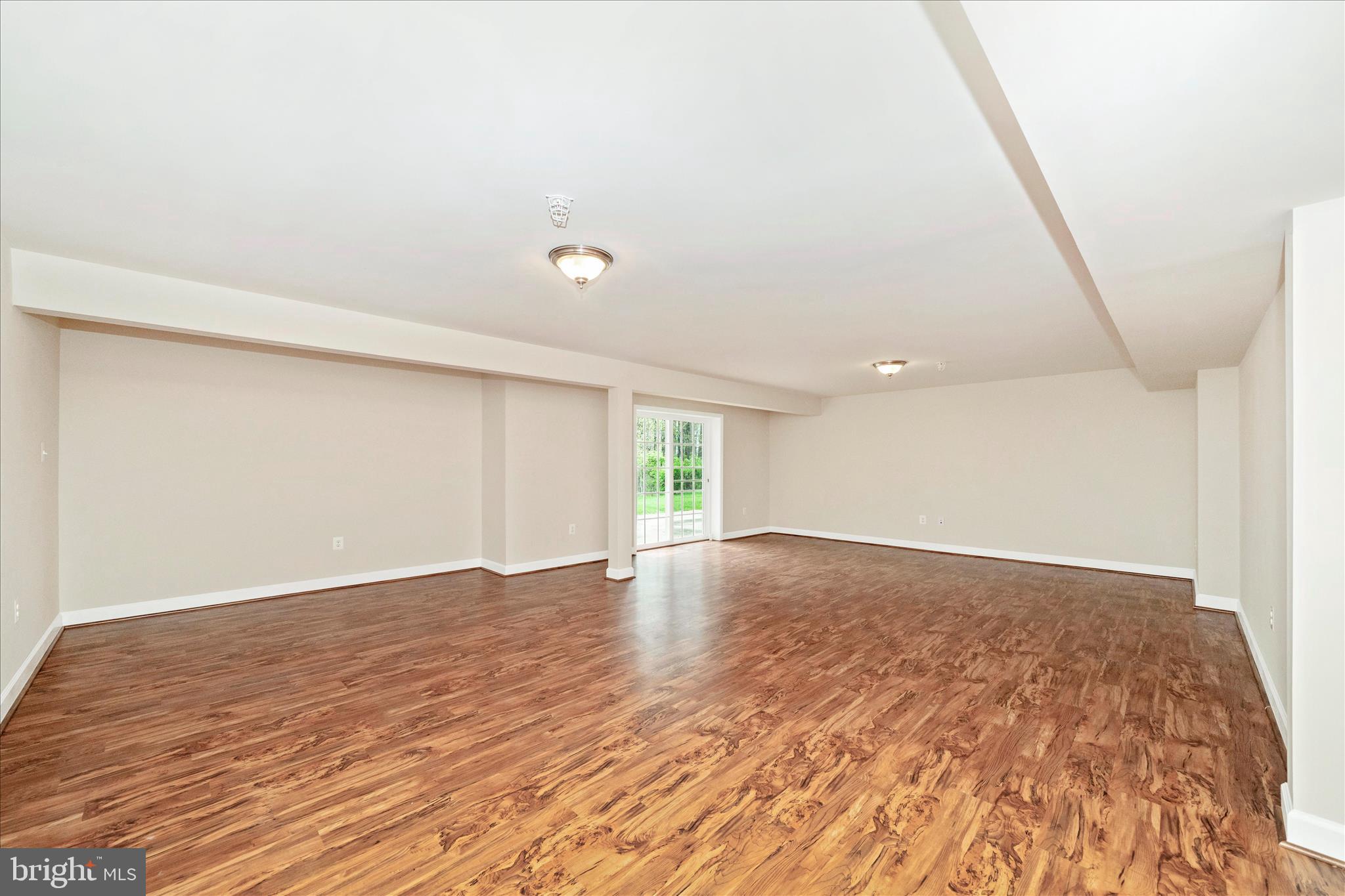 3156 Sumantown Road Middletown, MD 21769 - Photo 38 of 62 an empty room with wooden floor and windows
