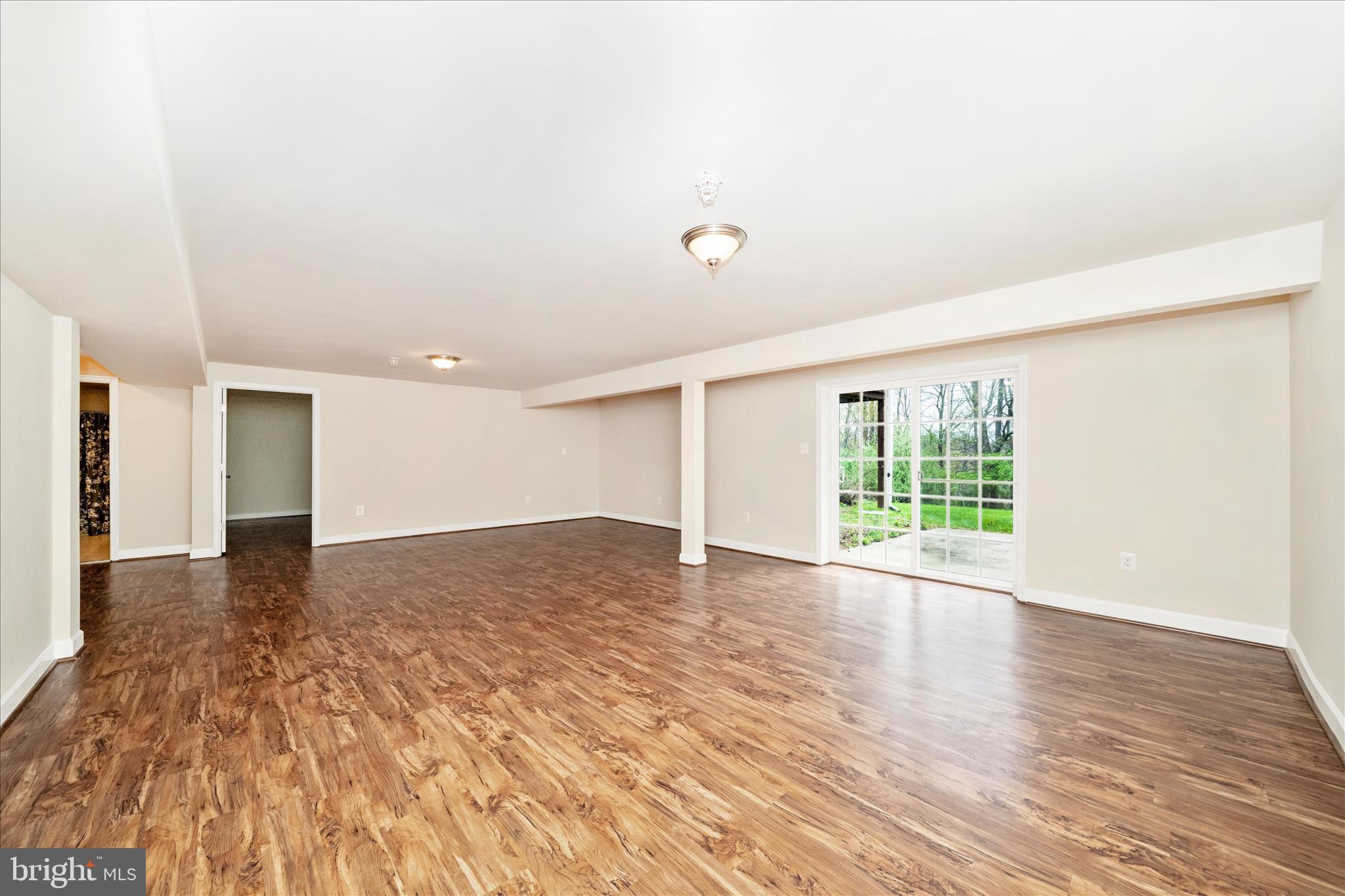 3156 Sumantown Road Middletown, MD 21769 - Photo 42 of 62 a view of an empty room with wooden floor and a window