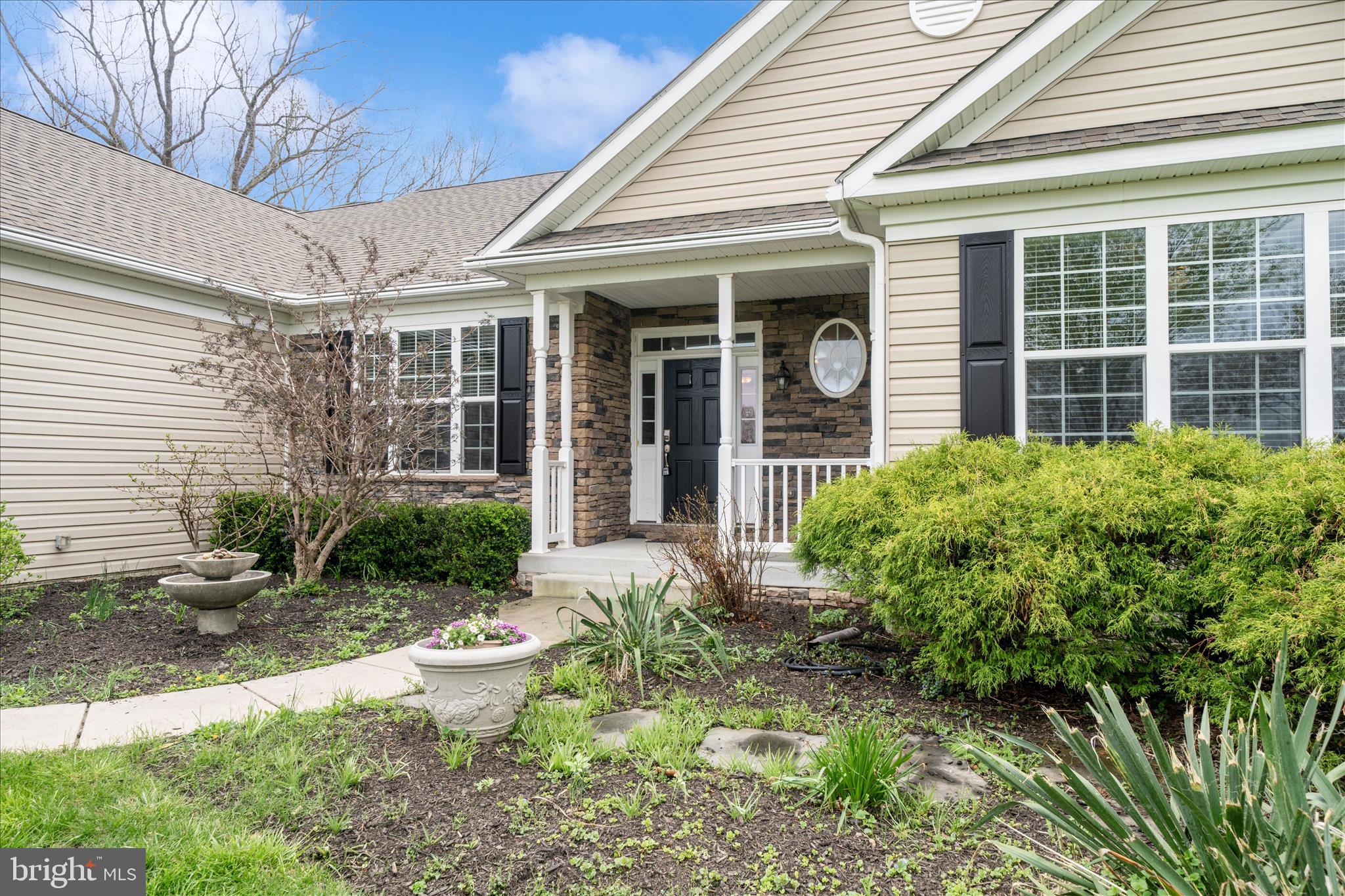 3156 Sumantown Road Middletown, MD 21769 - Photo 59 of 62 a view of a house with potted plants and a table and chairs