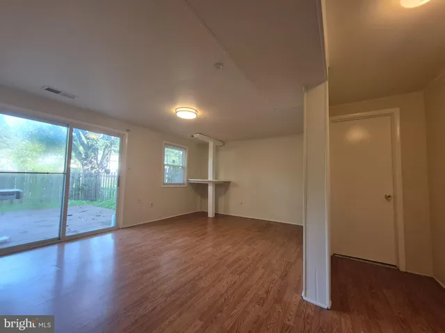 a white toilet sitting next to a shower