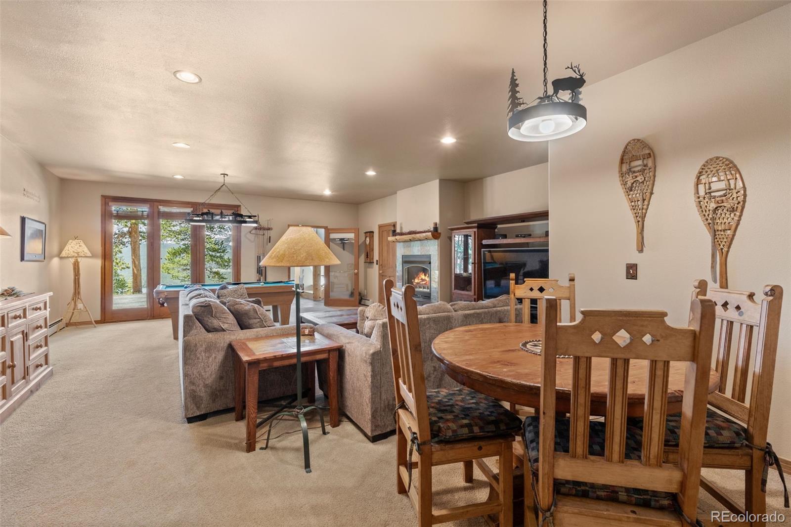 92 Emmett Lode Road, Unit B Breckenridge, CO 80424 - Photo 28 of 50 a dining room with furniture a chandelier and window