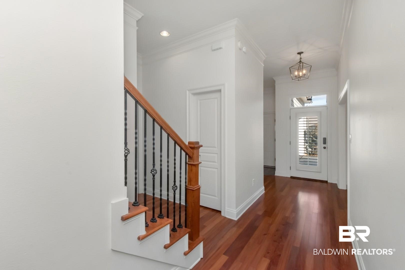 30585 Pine Court Daphne, AL 36527 - Photo 3 of 49 Foyer entrance with stairs, dark wood-style flooring, ornamental molding, a chandelier, and recessed lighting