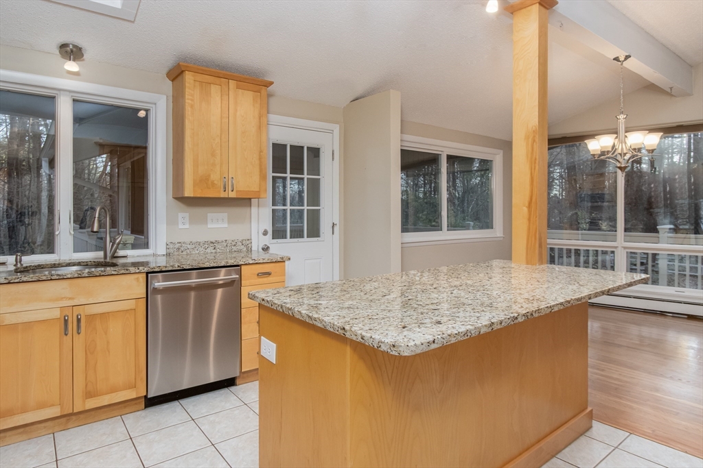 7 No Name Road Stow, MA 01775 - Photo 14 of 42 a kitchen with stainless steel appliances granite countertop a sink and a granite counter tops