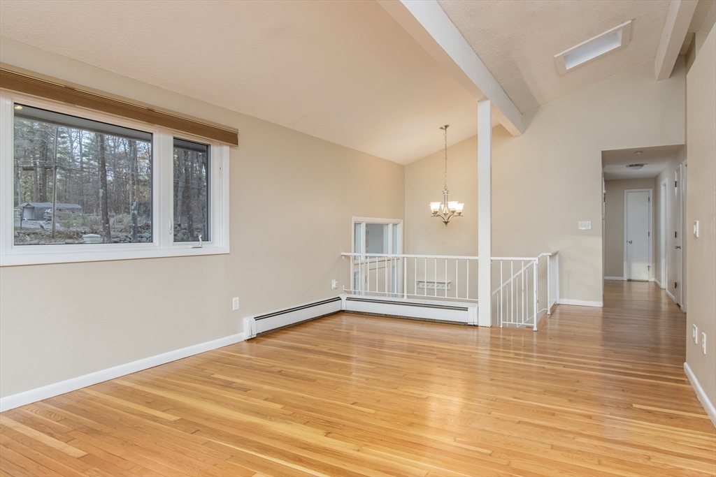 7 No Name Road Stow, MA 01775 - Photo 18 of 42 a view of empty room with wooden floor and fan