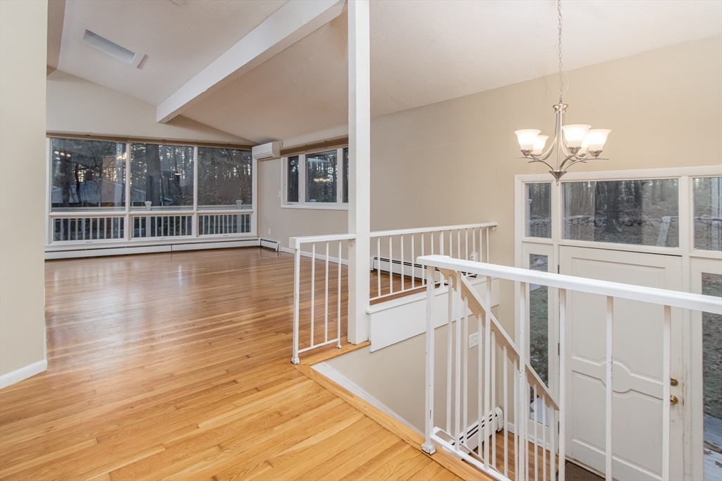 7 No Name Road Stow, MA 01775 - Photo 20 of 42 a view of a room with wooden floor and windows