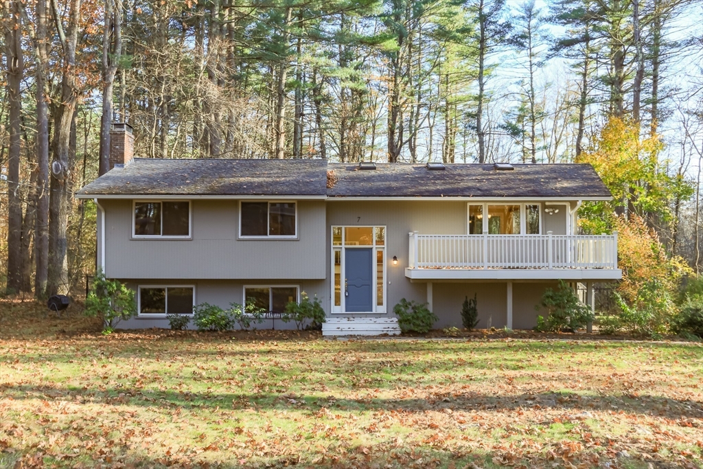 7 No Name Road Stow, MA 01775 - Photo 2 of 42 a front view of a house with a yard outdoor seating and garage