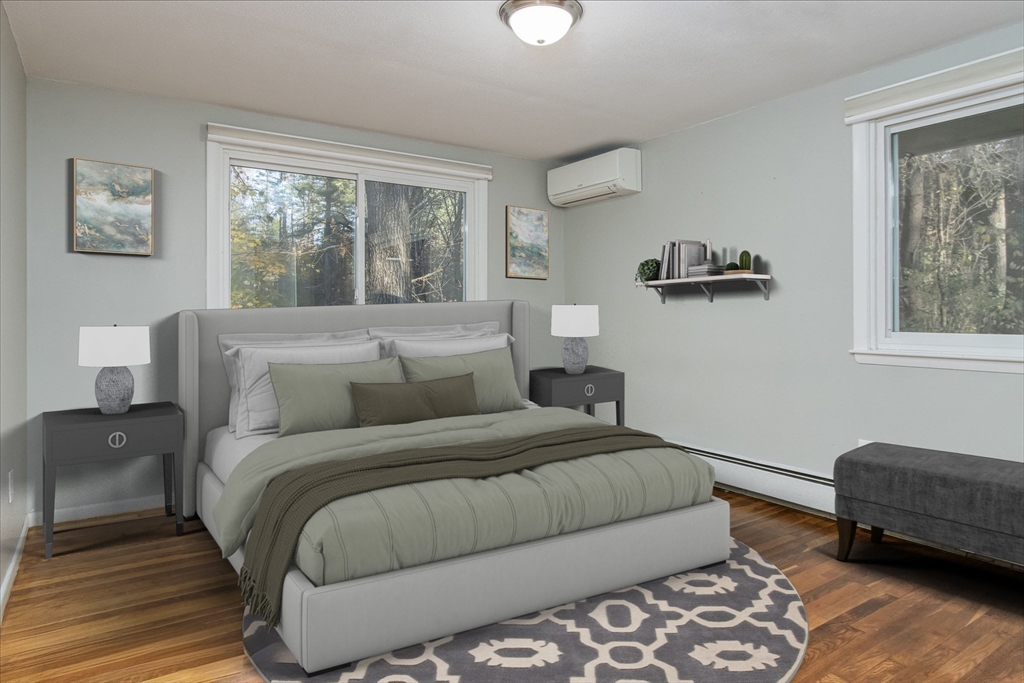 7 No Name Road Stow, MA 01775 - Photo 23 of 42 a bedroom with a bed and wooden floor
