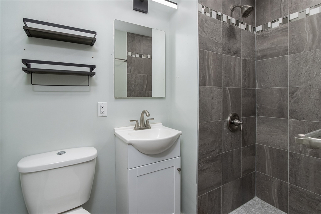 7 No Name Road Stow, MA 01775 - Photo 25 of 42 a bathroom with a sink a toilet and shower