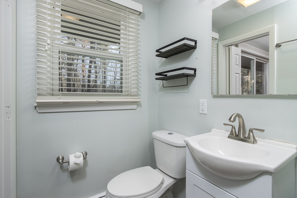 7 No Name Road Stow, MA 01775 - Photo 26 of 42 a bathroom with a toilet a sink and mirror