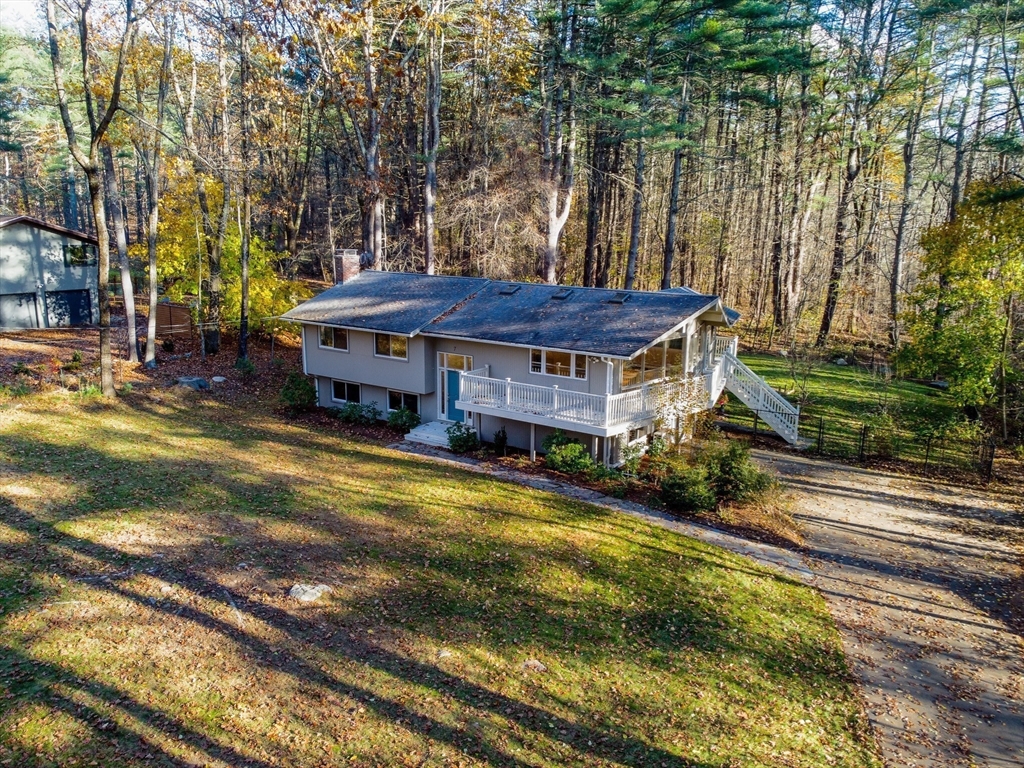 7 No Name Road Stow, MA 01775 - Photo 3 of 42 a view of a house with a yard and tree s