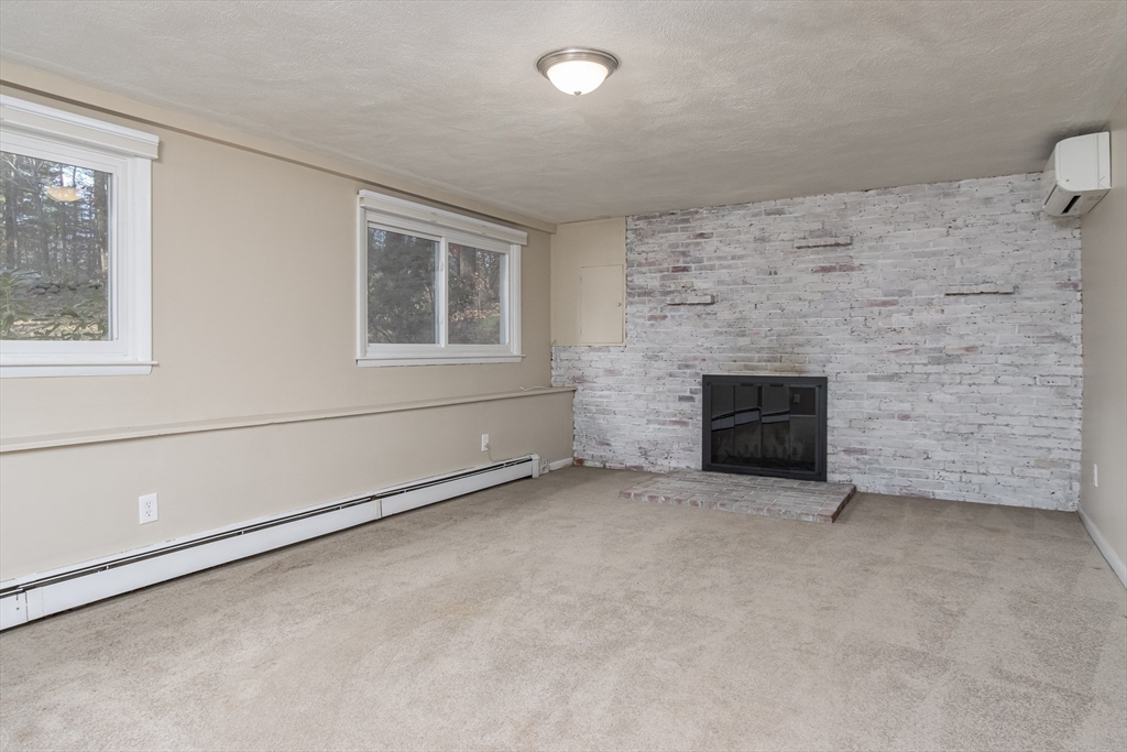 7 No Name Road Stow, MA 01775 - Photo 34 of 42 an empty room with windows
