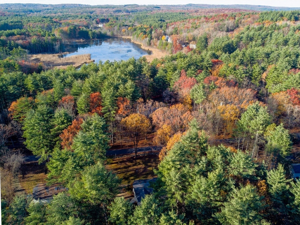 7 No Name Road Stow, MA 01775 - Photo 4 of 42 an aerial view of residential house with outdoor space and trees all around