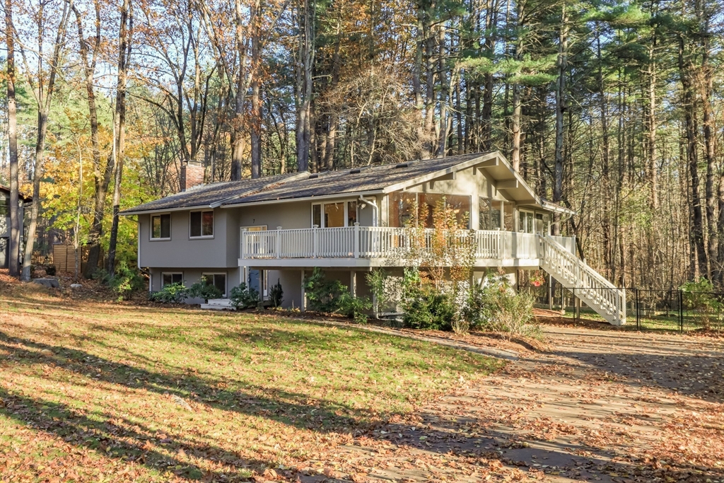 7 No Name Road Stow, MA 01775 - Photo 5 of 42 a front view of a house with a yard