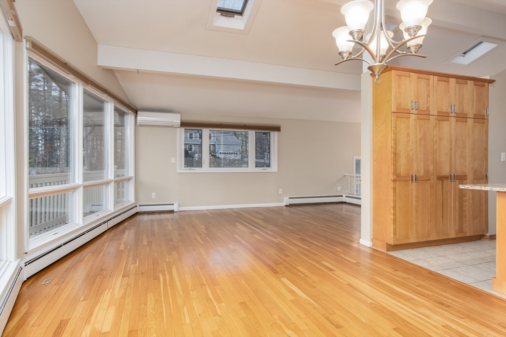 7 No Name Road Stow, MA 01775 - Photo 8 of 42 wooden floor in an empty room with a window