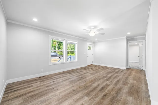 a view of an empty room with a window