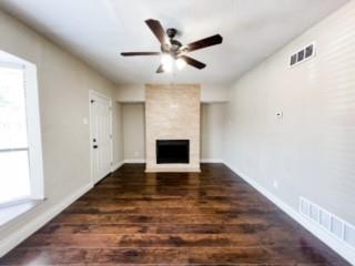 4512 Sycamore Street Dallas, TX 75204 - Photo 5 of 23 Living Room sits at the front of the units with a wood burning fire place and custom tile hearth