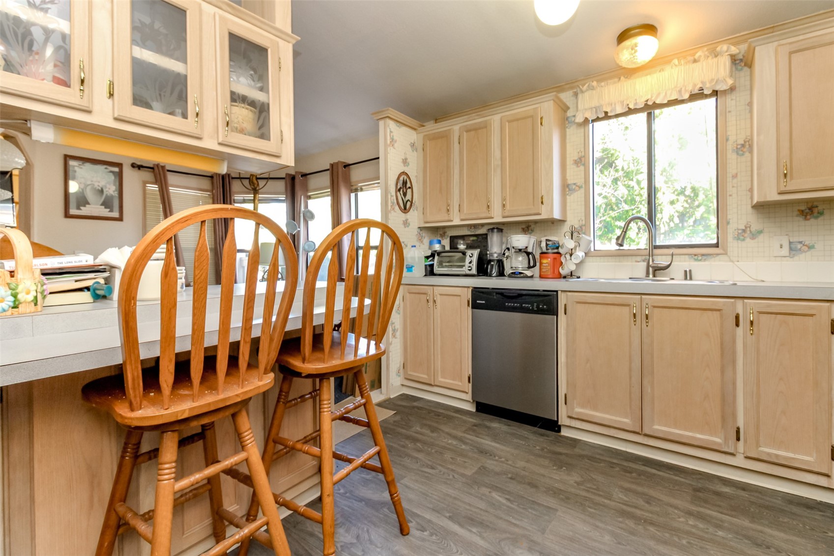2611 South 288th Street, Unit 74 Federal Way, WA 98003 - Photo 11 of 30 a view of a kitchen with a sink and cabinets