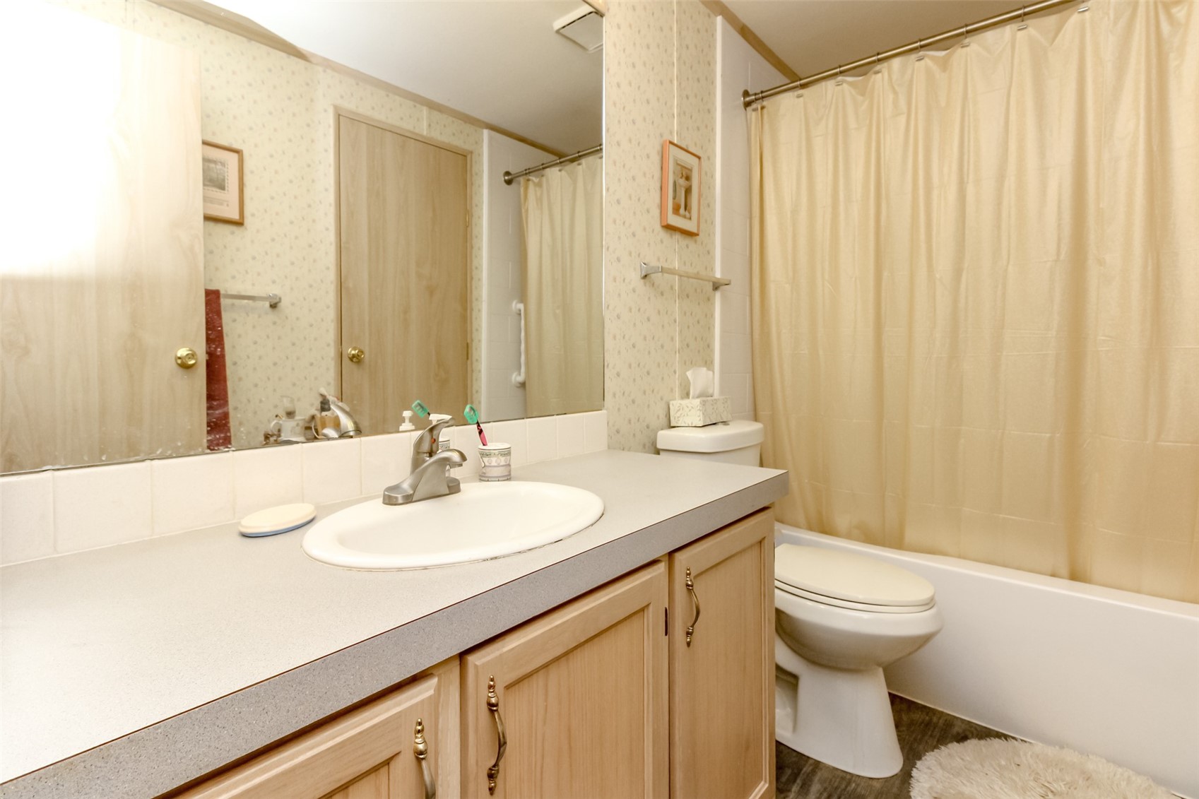 2611 South 288th Street, Unit 74 Federal Way, WA 98003 - Photo 14 of 30 a bathroom with a sink and a mirror