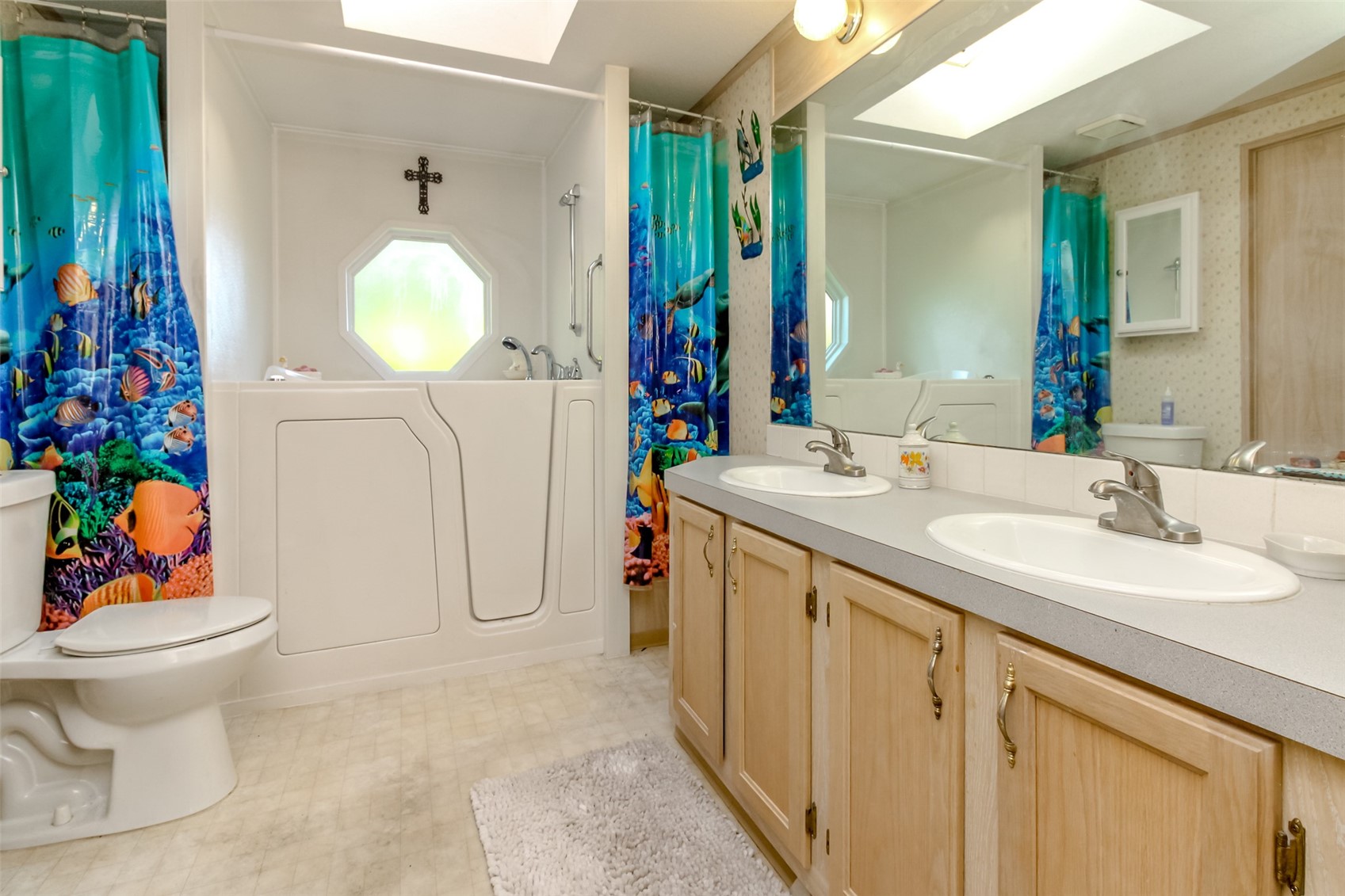 2611 South 288th Street, Unit 74 Federal Way, WA 98003 - Photo 16 of 30 a bathroom with a sink vanity mirror and toilet