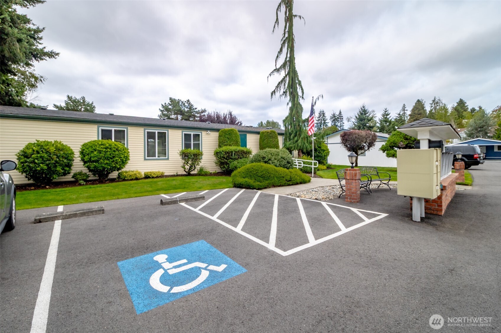 2611 South 288th Street, Unit 74 Federal Way, WA 98003 - Photo 22 of 30 a view of a house with a patio and a yard