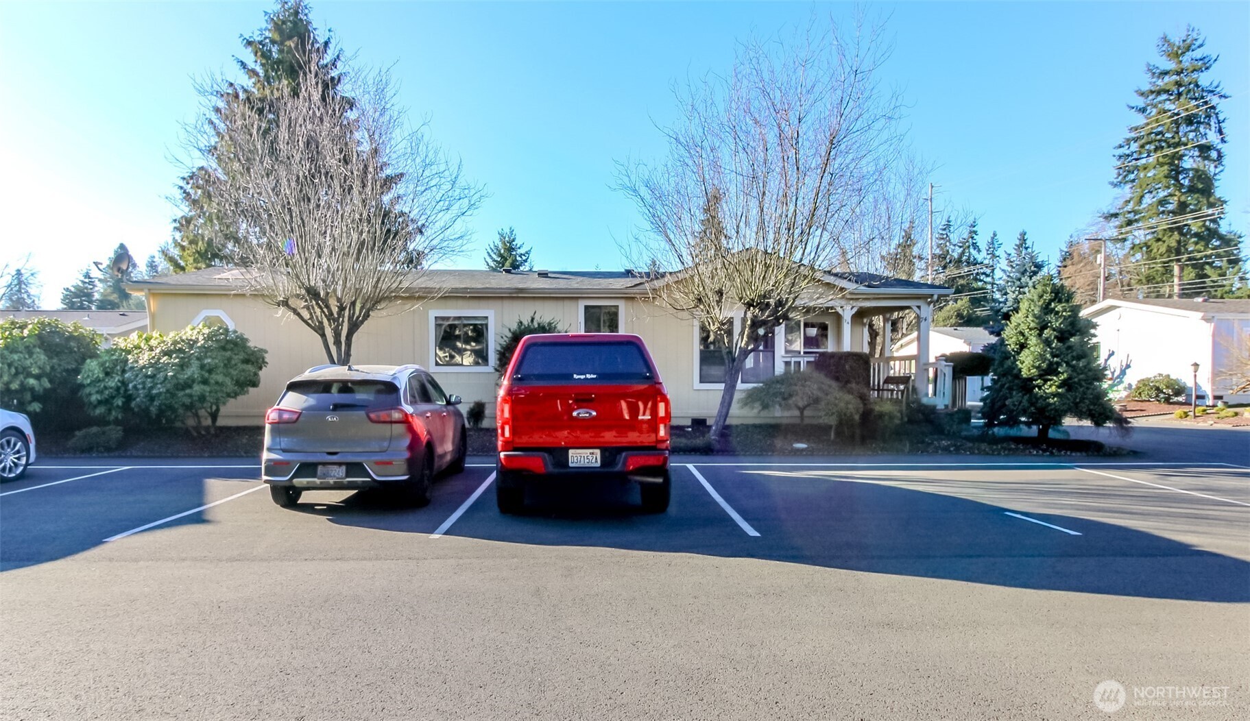 2611 South 288th Street, Unit 74 Federal Way, WA 98003 - Photo 25 of 30 a car parked in front of a house