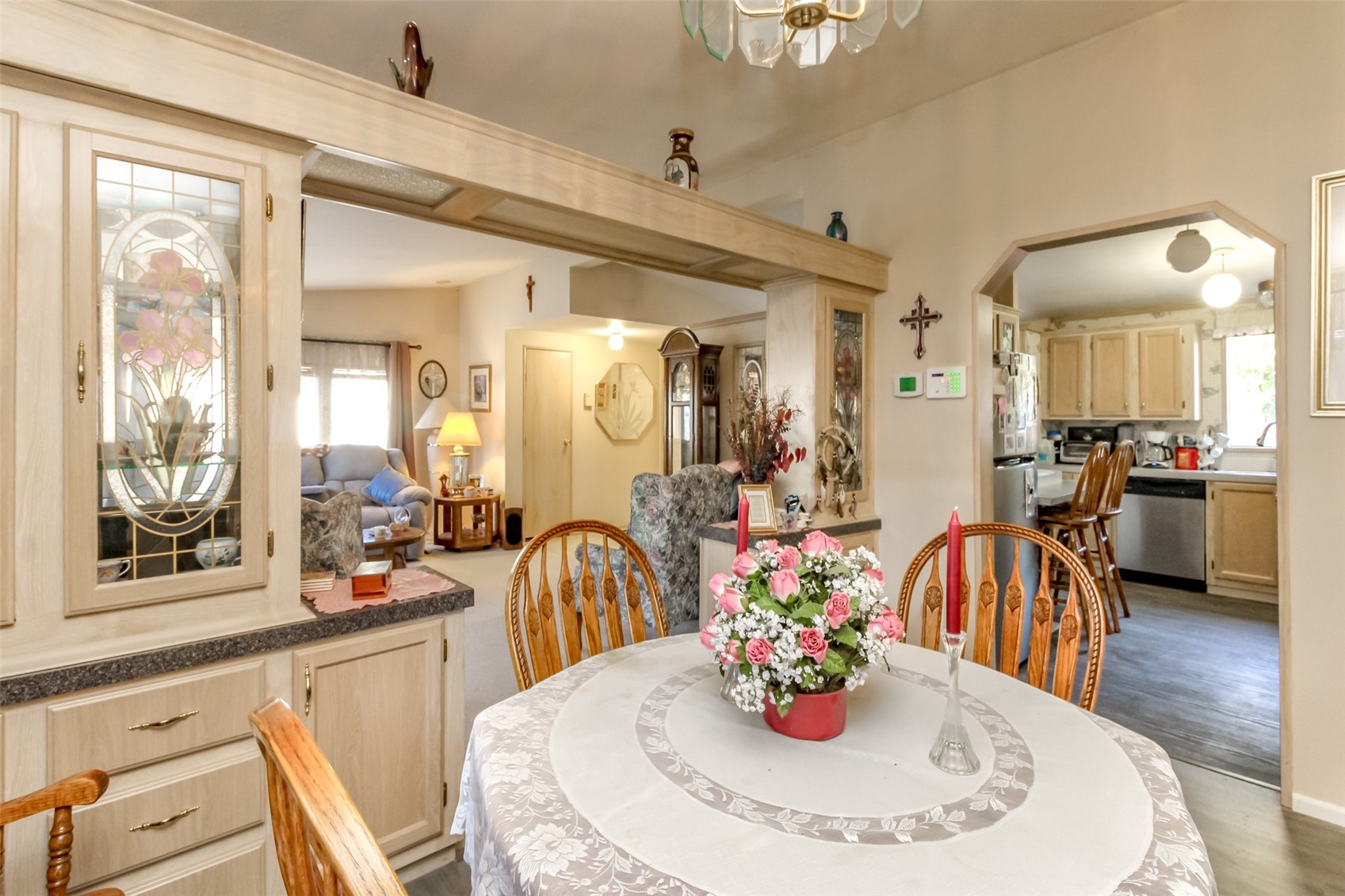 2611 South 288th Street, Unit 74 Federal Way, WA 98003 - Photo 7 of 30 a dining room with wooden floor and chandelier