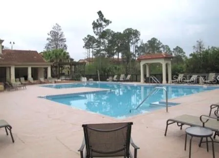 a view of a swimming pool with a patio