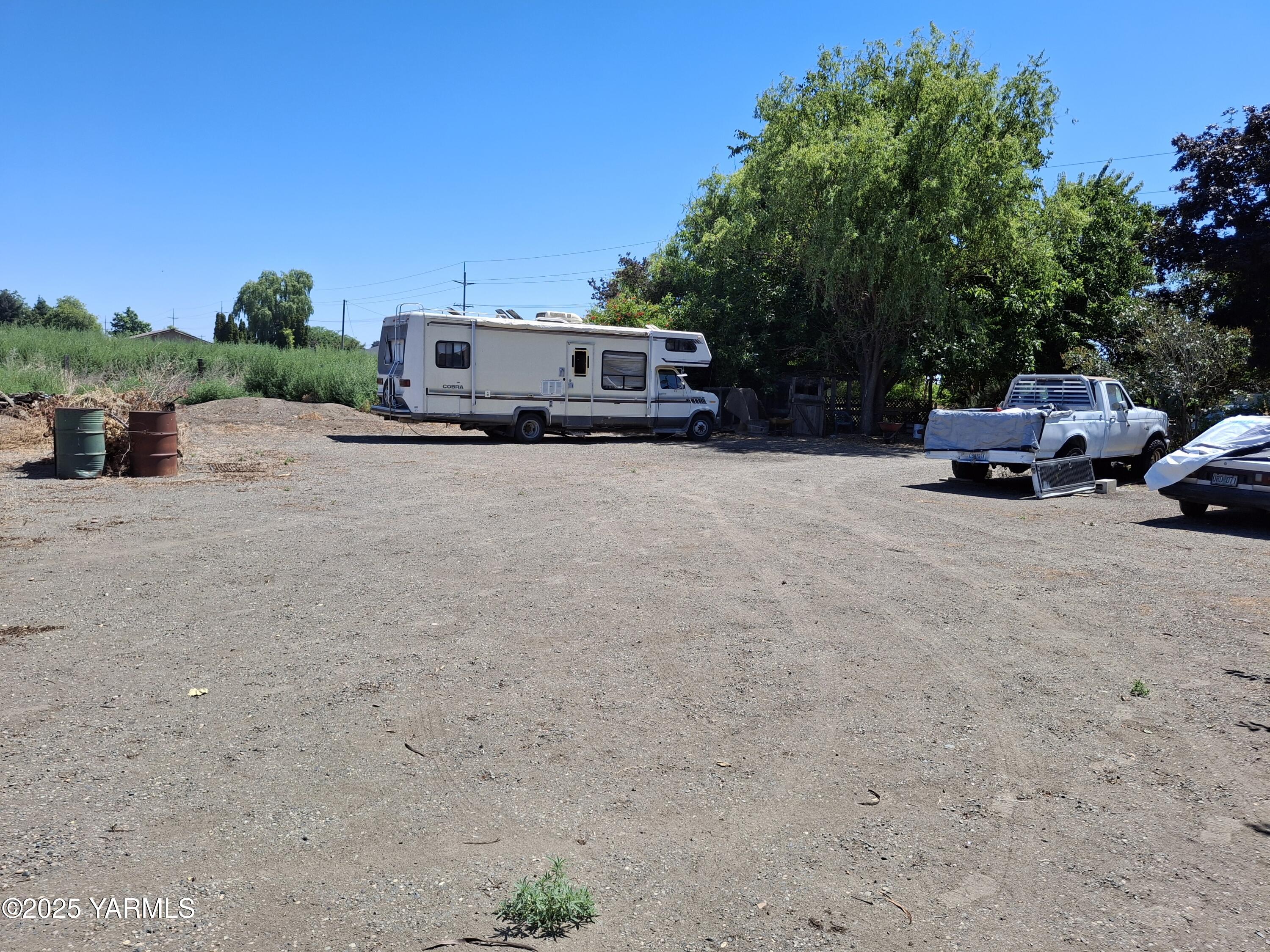 1371 Alexander Road Sunnyside, WA 98944 - Photo 4 of 5 a car parked in front of a house