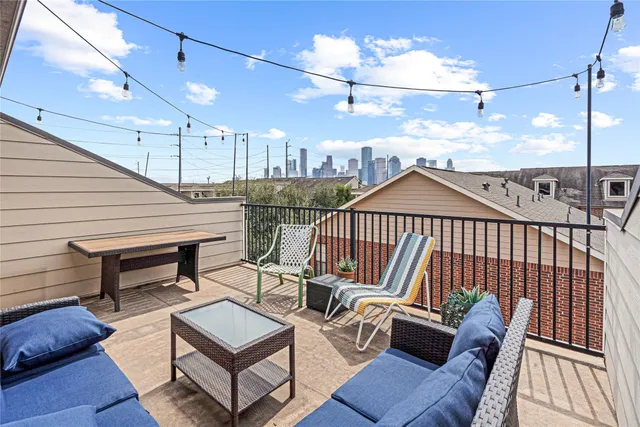 a view of a balcony with furniture